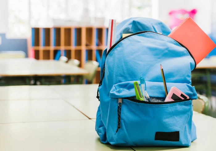blue schoolchild-backpack table