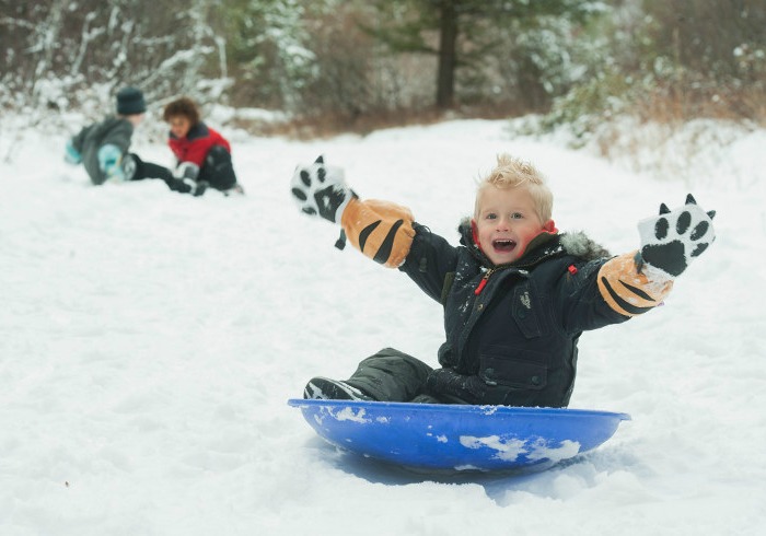 Mittyz thumbless gloves - boy in sleigh