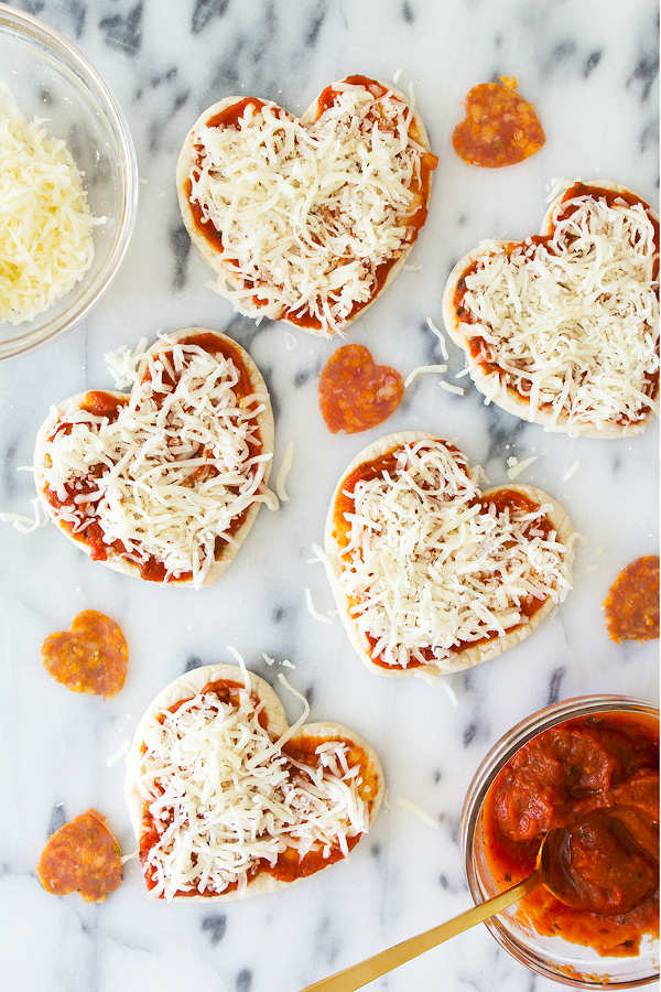 11 Heart Shaped Snacks and Treats Featuring Mini heart-shaped pizzas (via Sarah Hearts)